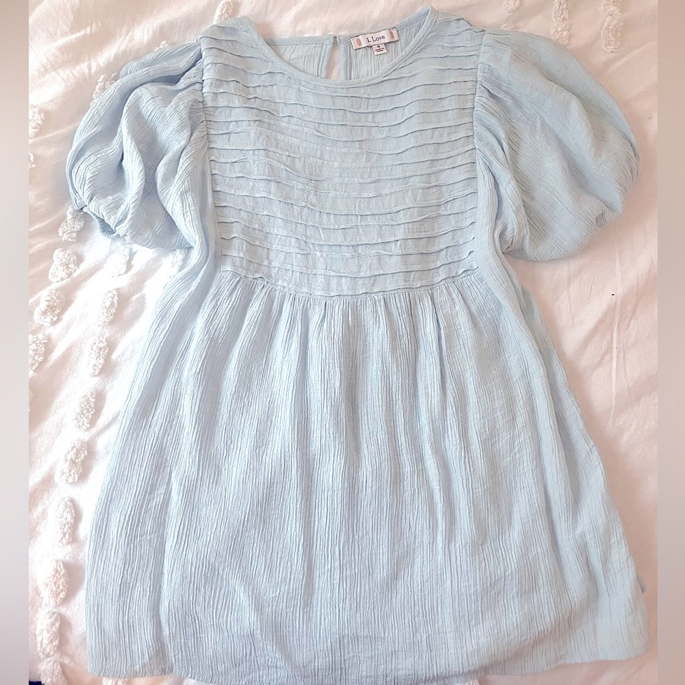 Baby blue baby doll top with tie in the back